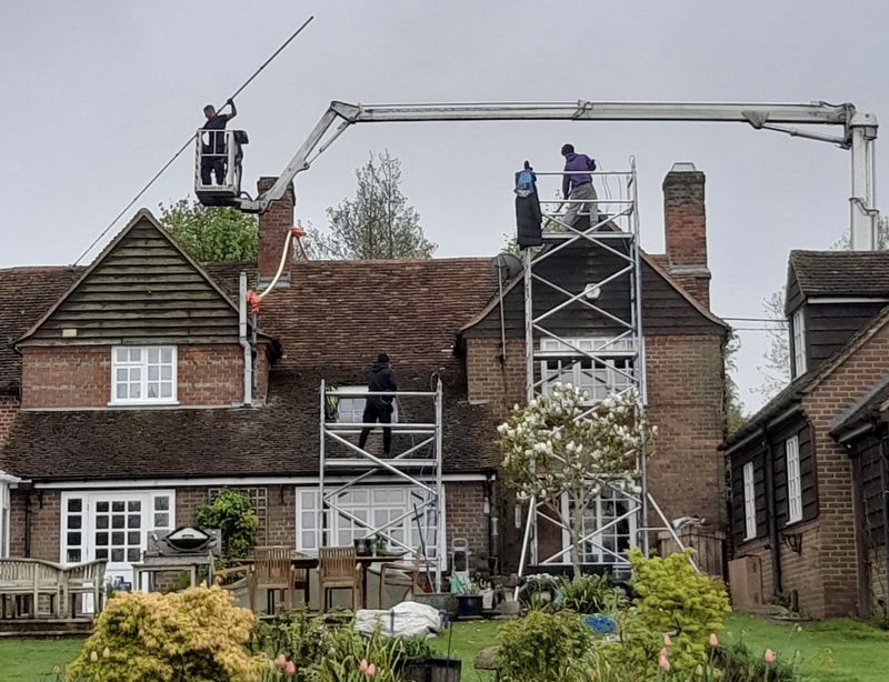 The Moss Cleaners using cherry picker and scaffolding to clean roof safely and professionally in 20 Osterley Ave, Osterley, Isleworth TW7 4QF, UK, 20 Osterley Ave, Osterley, Isleworth TW7 4QF, UK